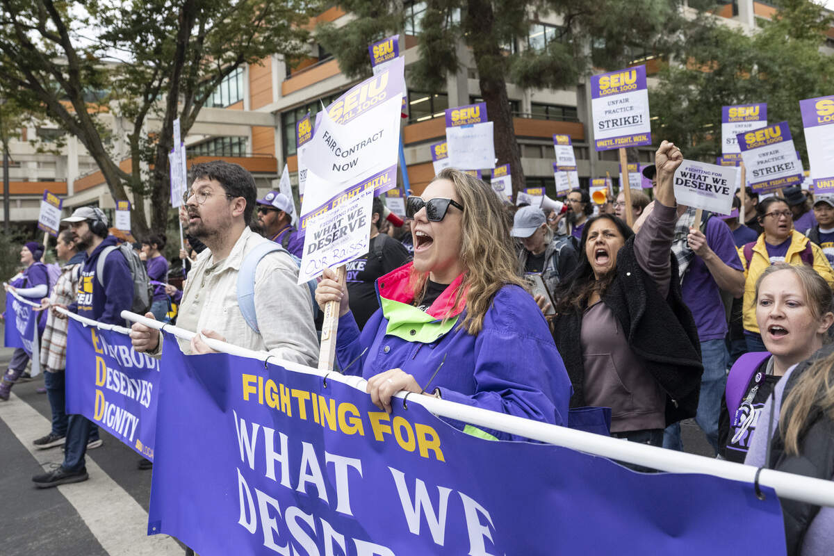 SEIU 1000 members march down P Street during a strike in Sacramento on Wednesday, Oct. 21, 2026.